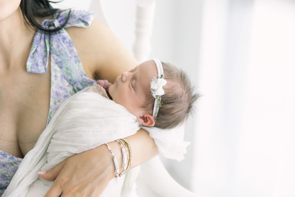 baby resting in moms arms in an Arizona Newborn Photo Session