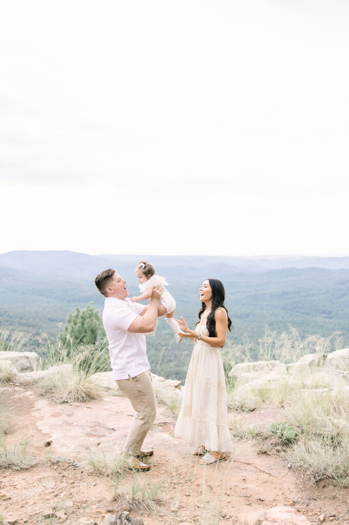 family posing for photos at the Mogollon Rim