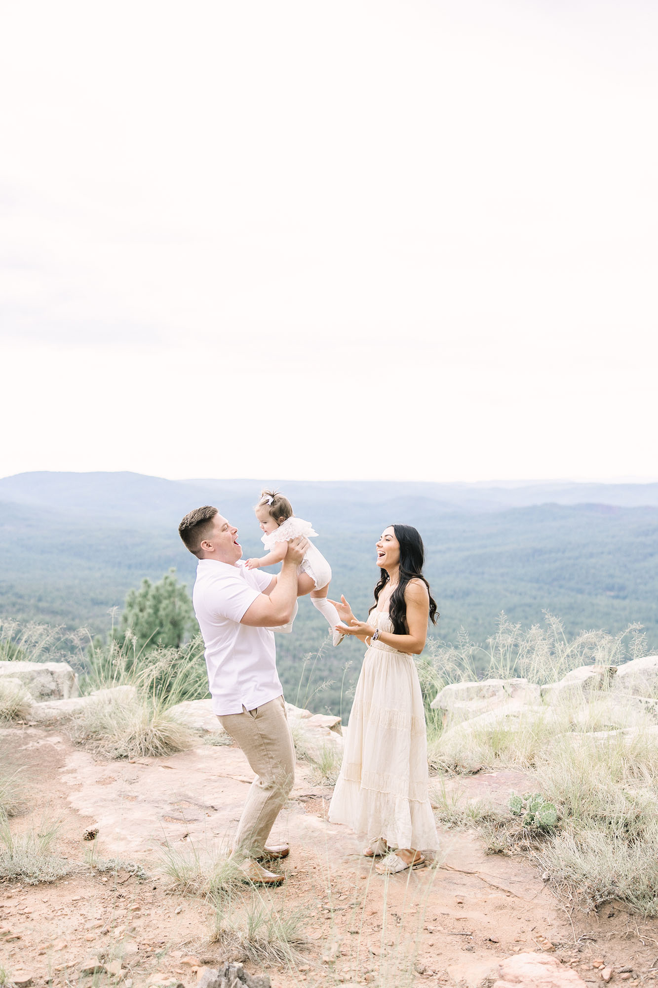 family posing playfully at the Mogollon Rim for family photos
